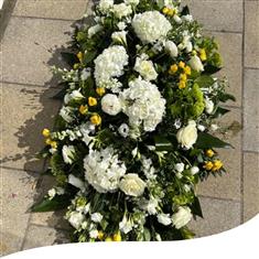 Large, white and yellow coffin spray