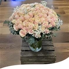 100 Pink Mondial Roses in a vase 