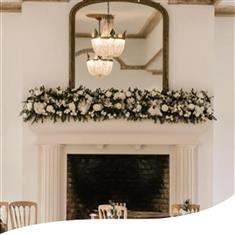 White Orchid and Rose Fireplace Arrangement 